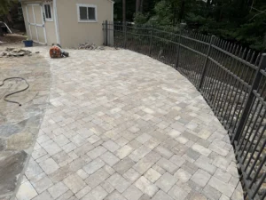 Custom Belgard paver patio installed to replace a failing hardscape around a residential swimming pool in North Raleigh.
