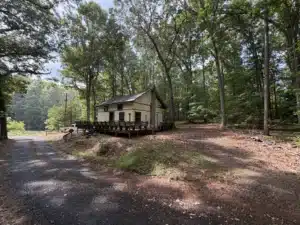 Existing 1,000-square-foot house on a residential property in Asheboro, NC before demolition and land clearing by MWM Landscaping & Grading.